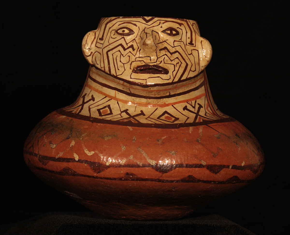 effigy pot in red and white