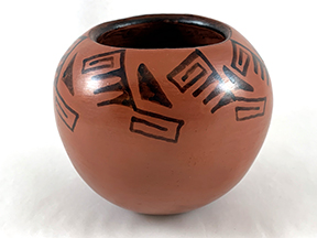 red clay bowl with black design