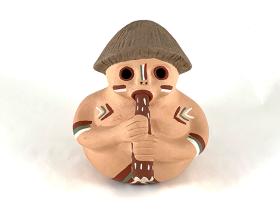 red clay in shape a human holding flute