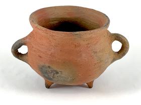 undecorated red bowl with handles and feet