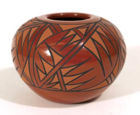 red clay bowl with complex patterning