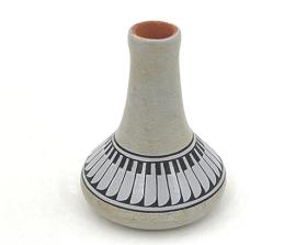 white vase with intricate black pattern 