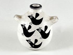 white pot with black birds