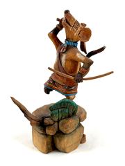 the mouse warrior is carved figuratively and clearly a mouse, holding his bow and dancing