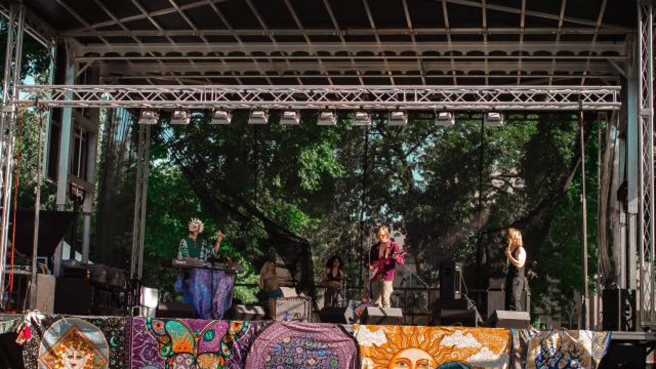 Trio of performers on stage