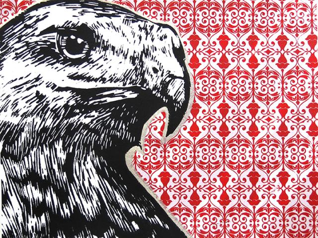 Eagle in black and white with background of red and white geometric design